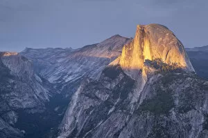 Images Dated 8th April 2022: Golden evening sunlight lights up Half Dome above Yosemite Valley, Yosemite National Park