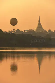 Gilded Prints: The golden stupa of the Shwedagon Pagoda and the Mingalarbar hot air baloon reflected in