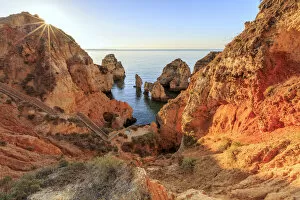 Golden Gallery: Golden sunrise on the red cliffs of Ponta da Piedade Lagos Algarve Portugal Europe