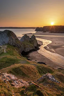 West Glamorgan Prints: Golden sunset over Three Cliffs Bay on the Gower Peninsula