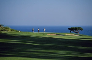 Golf Prints: Golfers play on the championship course