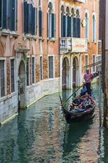 Images Dated 19th October 2014: Gondola boat passing through a narrow canal, Venice, Veneto, Italy