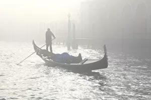 Gondola across the Grand Canal due to fog, Venice, Veneto, Italy