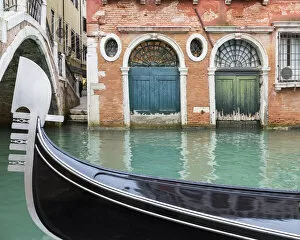 Images Dated 2nd May 2017: Gondola passes two old doors on canal, Venice, Veneto, Italy
