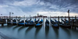 Gondolas moored at sunset, St. Marks basin, Venice, Italy