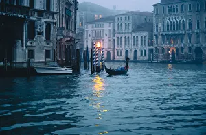 Gondolas near Rialto bridge during a cloudy day. Venice, Veneto, Italy Gondolas near Rialto bridge during a cloudy day. Venice, Veneto, Italy