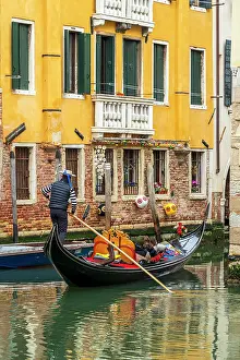 Canal Prints: Gondolier and gondola boat in a small water canal, Venice, Veneto, Italy
