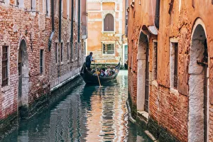 Gondolier Prints: Gondolier and gondola in Cananregio, Venice, Veneto, Italy