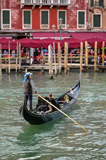 Gondolier Prints: Gondolier riding a gondola boat on Grand Canal, Venice, Veneto, Italy