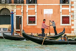 Venezia Prints: Gondoliers riding a gondola boat on Grand Canal, Venice, Veneto, Italy