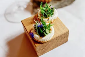 Dining Prints: Gourmet appetizers with edible flowers on a wooden board