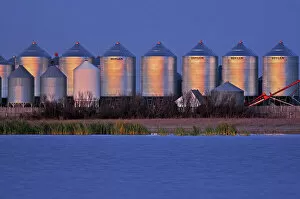 Agribusiness Gallery: Grain bins at dusk Tuxford Saskatchewan, Canada