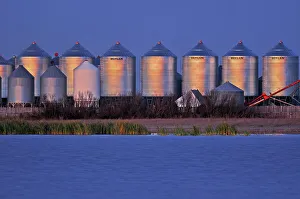 Agribusiness Gallery: Grain bins at dusk Tuxford Saskatchewan, Canada
