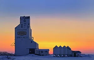 Prairie Sentinel Collection: Grain elevator and bins at sunset Birch Hills Saskatchewan, Canada