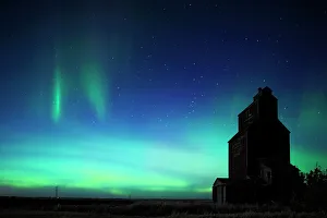 Food Gallery: Grain elevator in ghost town with northern lights in the northern sky Lepine Saskatchewan, Canada