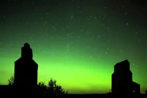 Ghost Town Prints: Grain elevator in ghost town with northern lights in the northern sky Lepine