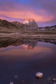 Gran Sasso Mountain at sunrise reflected in the lake, Campo Imperatore, L Aquila