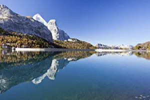The Gran Vernel reflected in Lake Fedaia in an autumn morning