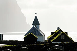 Fjord Collection: Grass roof houses and old church of Vidareidi, Vidoy Island, Faroe Islands