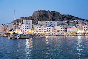 Meditarranean Country Prints: Greece, Dodecanese, Karpathos, the illuminated port city of Pigadia in the evening