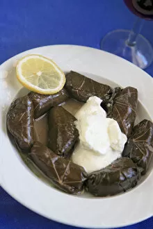 Images Dated 13th May 2010: Greek Cuisine. Fresh Dolmades, Vine Leaves with Yogurt and glass of Red Wine