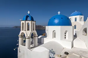 Greek orthodox church with blue domes in Oia, Santorini, South Aegean, Greece