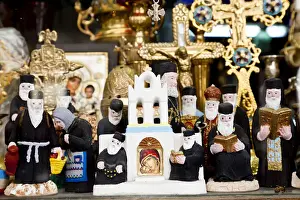 Greek Orthodox priest models & other orthodox icons in shop front, Athens, Greece
