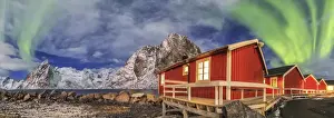 Hamnoy Prints: The green light of the aurora borealis lights up fishermans cabins