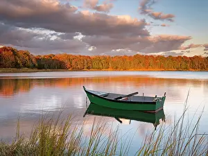 Salt Pond Prints: Green rowboat with reflection in autumn on Cape Cod, Eastham, Massachusetts, USA
