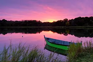 Salt Pond Prints: Green rowboat at sunrise with reflection on Cape Cod