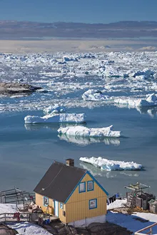 Greenland, Disko Bay, Ilulissat, elevated town view with floating ice