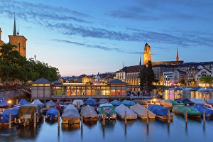 Vessels Prints: Grossmunster and boats on Limmat River at dusk, Zurich, Switzerland