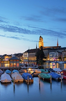 Vessels Prints: Grossmunster and boats on Limmat River at dusk, Zurich, Switzerland