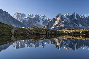 Snowy Gallery: The group of Mont Blanc is reflected in Lake Cheserys. Chamonix. Haute Savoie. France