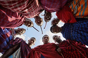 Masai Collection: A group of Msai wearing traditional 'shukas'in a village near Arusha