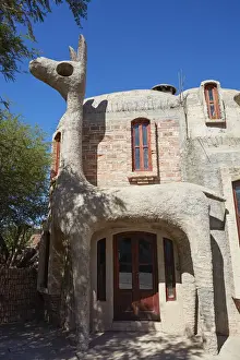 Calchaqu And Xed Prints: A guanaco sculpture at the entrance of a house in downtown Cafayate, Calchaquai Valleys