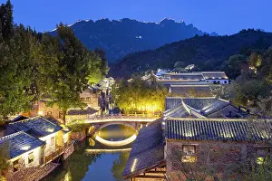 Canal Prints: Gubei Water Town with the Great Wall of China at Simatai (UNESCO World Heritage Site) in the background at dusk