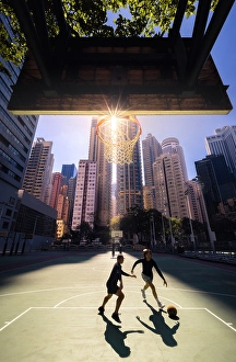 City Centre Prints: Two guys playing basketball in the middle of the buildings