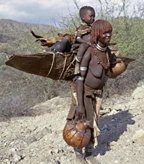 Ethiopia Prints: A Hamar mother and child moving home