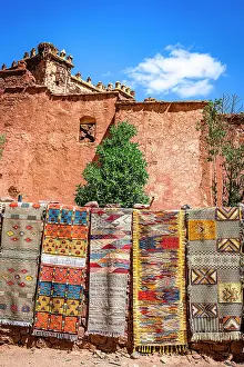 For Sale Prints: Handmade carpets for sale hanging outside the old ruins of Telouet Kasbah
