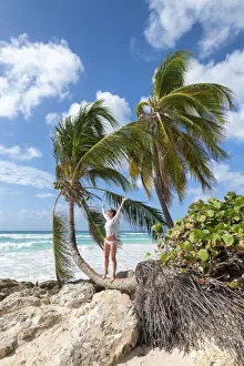 Barbados Gallery: Happy woman on the curved palm tree, Dover Beach, Oistins, Barbados Island