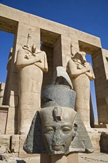 Images Dated 15th March 2007: Headless statues of Ramses II line the courtyard at