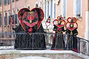 Masks Prints: Heart-shaped costumes posing on a bridge at the Venice Carnival, Venice, Italy