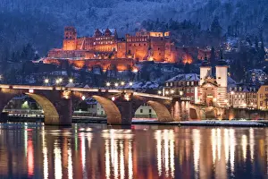 Heidelberg castle and Old Bridge illuminated in winter at night, Baden-Wurttemberg