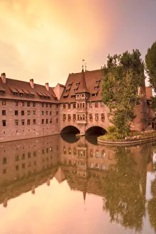 Images Dated 11th October 2018: Heilig-Geist Spital on River Pegnitz at sunset, Nuremberg, Bavaria, Germany