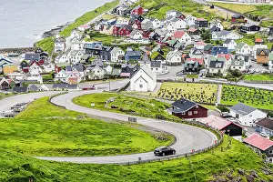Road Trip Prints: High angle view of car driving on winding road to the iconic Eidi village