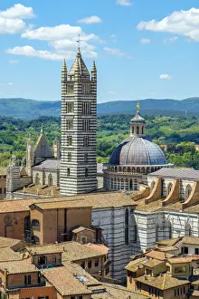 High angle view of Duomo di Siena (Siena Cathedral) and buildings in old town