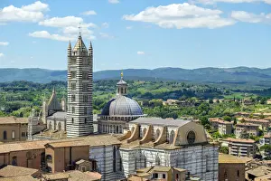 High angle view of Duomo di Siena (Siena Cathedral) and buildings in old town