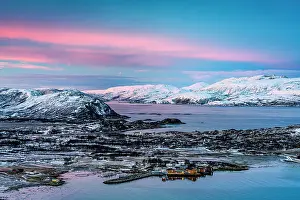 Beauty Prints: High angle view of the fishing village and harbor of Brensholmen covered with snow at dawn