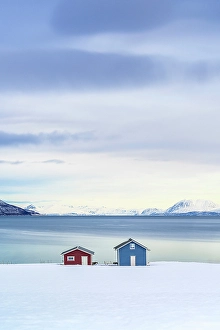 Fjord Prints: High angle view of lone fisherman cabins on a snowy beach, Tromso, Norway